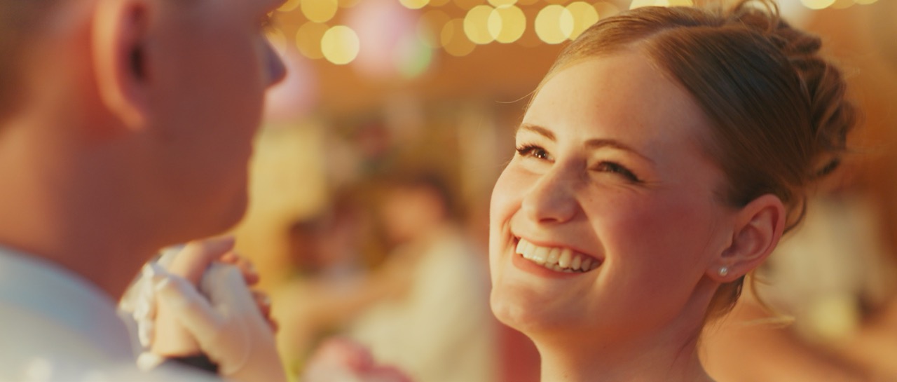 a man and a woman dance in prom attire