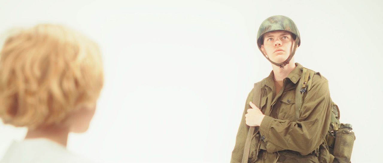 a man in a war uniform sees a young child in a white void