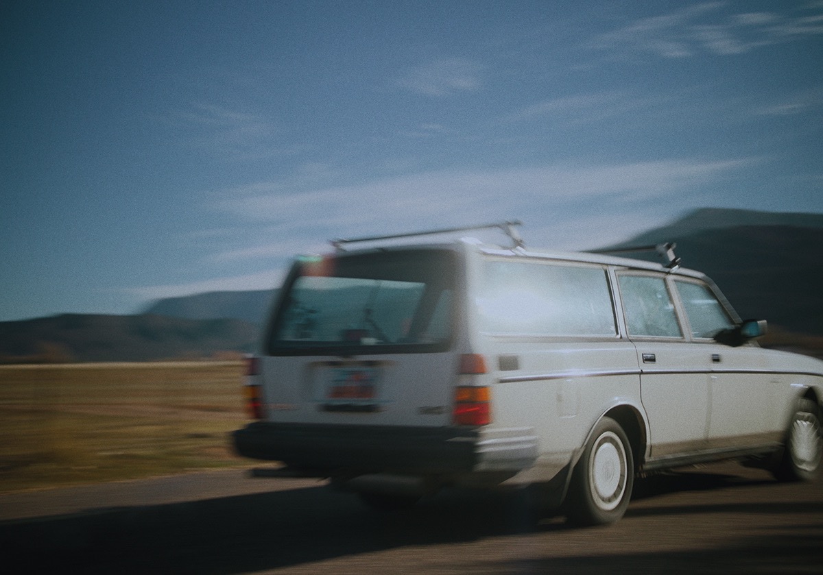 a station wagon drives past