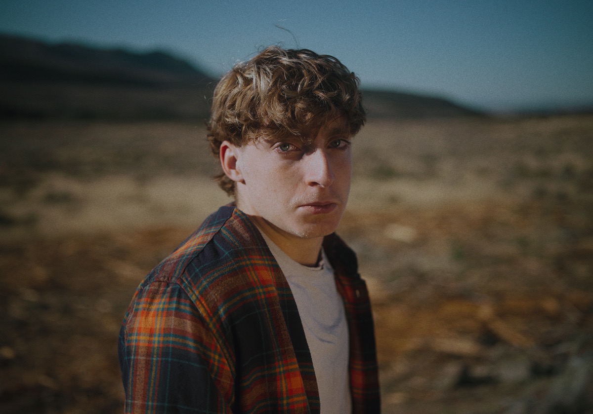 a boy looks out in shock