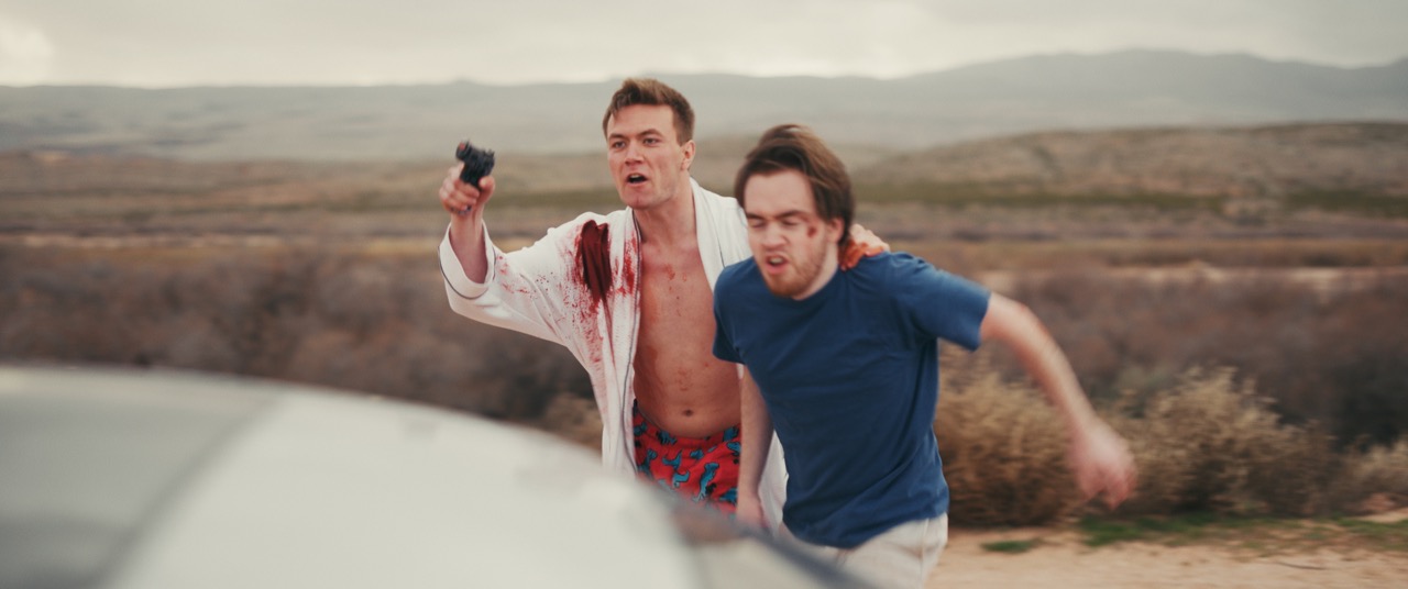 two friends dart to a car