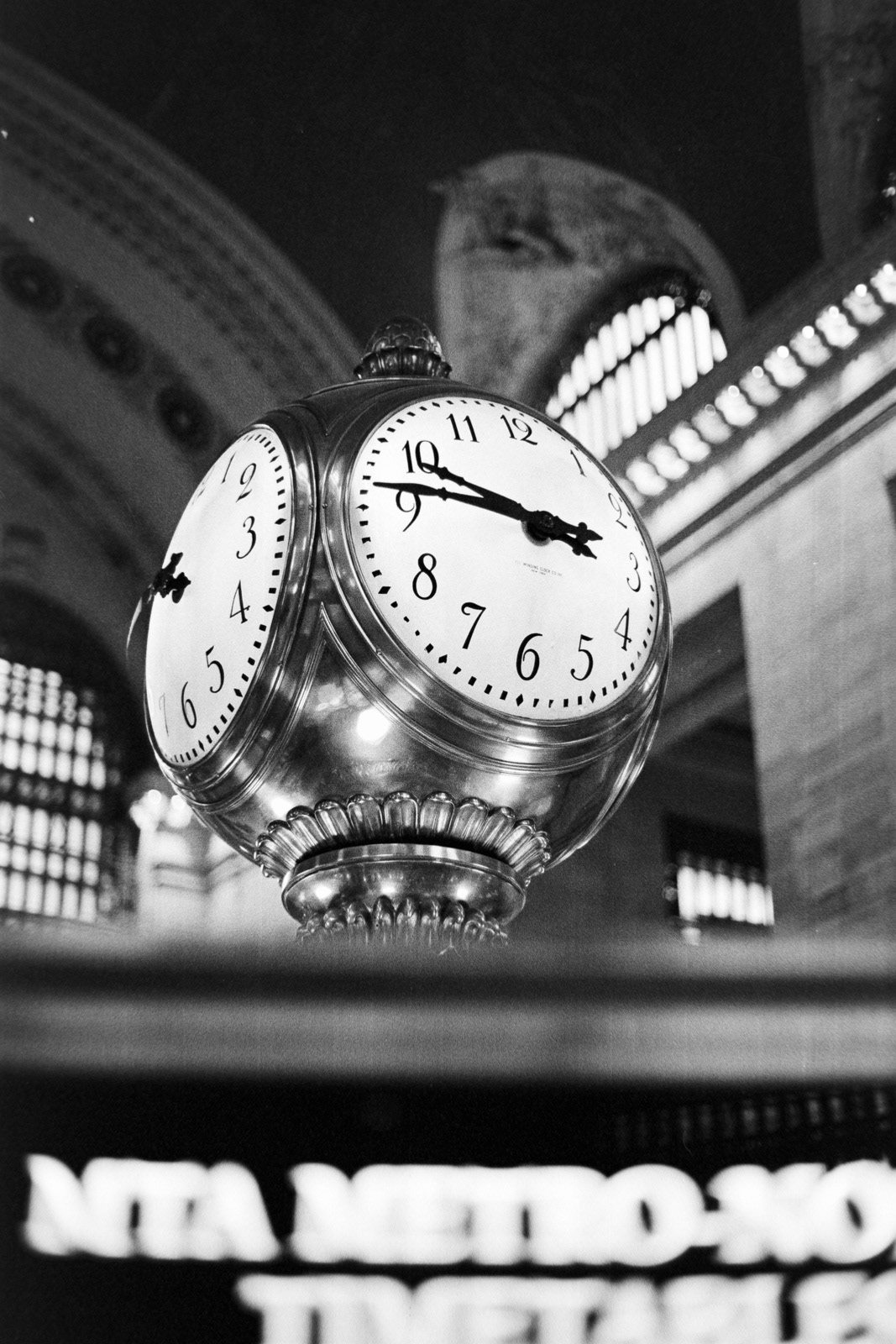 black and white photo of a clock in Grand Central Station